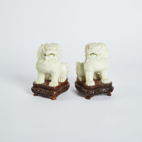 A Pair of Chinese 20th Century Jade Caving Lion Ornaments