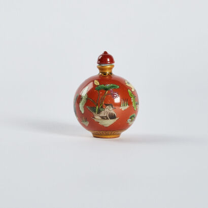 A Chinese coral-red ground famillie-rose 'birds and flowers' snuff bottle