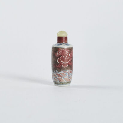 A Chinese underglaze-blue and copper-red dragon snuff bottle