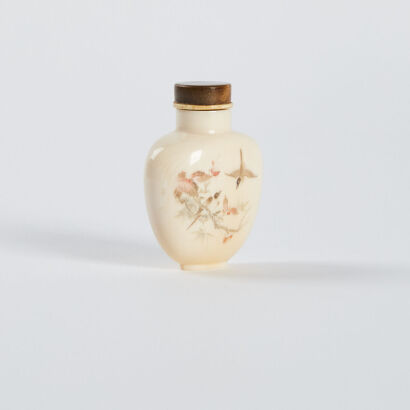 A Chinese early 20th Century carved bone snuff bottle with birds and flowers pattern