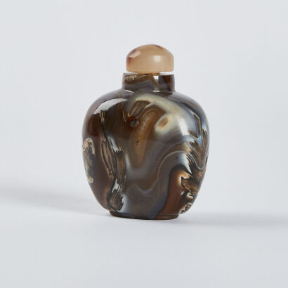 A Chinese silk brown agate snuff bottle