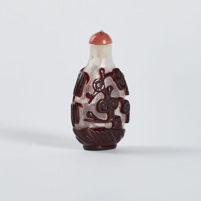 A Chinese Late Qing Dynasty snowstorm-ground and red-overlayed Snuff bottle with engraved horse pattern