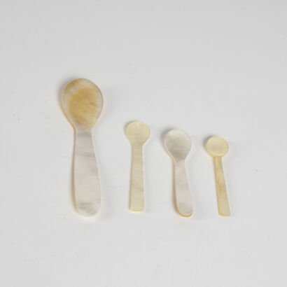 A Collection Of Four White Mother Of Pearl Caviar Spoons