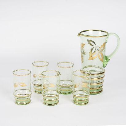 A Retro Water Jug With Four Glasses