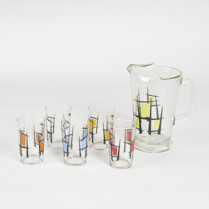 A Retro Water Jug With Five Glasses