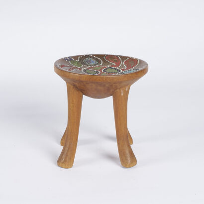 A Wooden Stool With Coloured Design