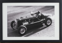 A Vintage Car Racing Black And White Print