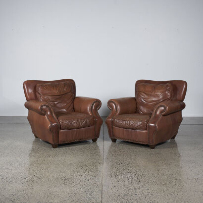 A Pair Of Vintage Brown Leather Lounge Chairs With Studded Detailing