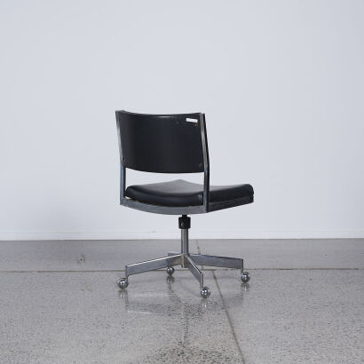 A Mid Century Industrial Black And Chrome Desk Chair