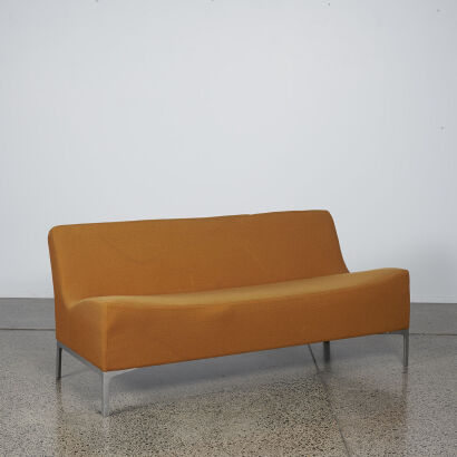 An Orange Three Seater Minimal Couch
