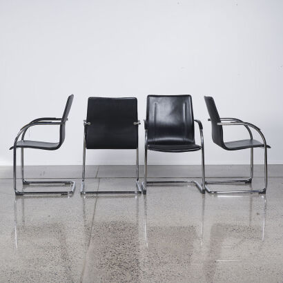 A Set Of Four Chrome Framed Cantilever Chairs With Black Upholstery