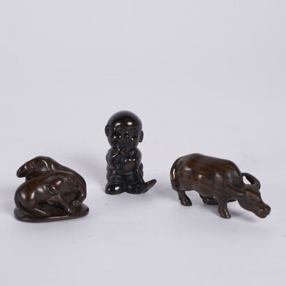 A Trio Of Small Dark Wood Carvings