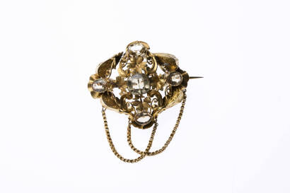 A mid-Victorian citrine brooch. The centre cushion cut citrine is set in a floral and leaf brooch with four surrounding citrines. Yellow gold. Weight 9.09 grams. Length 48mm. Width 47mm. 