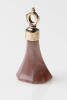 An agate fob, the pink carved agate hung with cap and bail. Rolled rose gold. Weight 7.23 grams. Length 38mm.