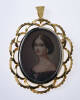 An Italian miniature pendant brooch, the hand painted miniature set with white stones in an open work frame 18ct yellow gold. Weight 7.2 grams. Length 50mm.