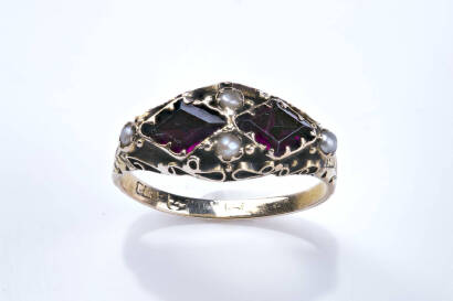 A Victorian ring, two diamond shaped amethyst and four seed pearls in engraved mount. Yellow gold. Weight 1.71 grams. Ring size L.