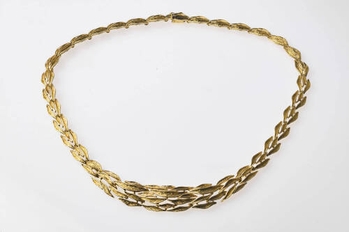 A gold neckchain the series of graduated triple rows of woven leaf design are textured with polished borders. 14ct yellow gold. &nbsp;Weight 46.97 grams. Length 45cm.