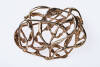 A gold brooch. Designed as a tangle of vines and leaf branches. Dimensions 37mm x 48mm. 14ct yellow and rose gold. Weight 18.3 grams.