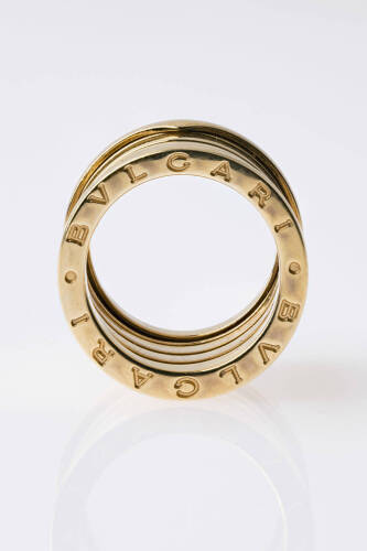A yellow gold ring, Bulgari. The B.Zero ring with adjustable spiral bands and engraved edges. 18ct yellow gold. &nbsp;Weight 12 grams. Size M.&nbsp;