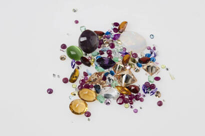 Mixed parcel of loose used gemstones. Emeralds, ruby, opal, citrine, sapphire, topaz etc. (100 approx).