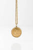 A gold Singapore coin on chain. Weight 44.96 grams. Length 74.5cm.