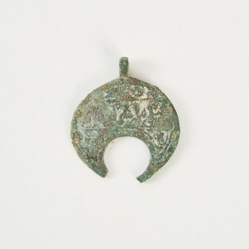 A Bronze Islamic Lunate Pendant