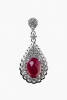 A pair of ruby and diamond drop earrings, two oval cabochon rubies of estimated total weight 7.37 carats surrounded by diamonds of estimated total weight 1.69 carats set in pear drop mounts. 18ct white gold. Length 34mm. Post and butterfly attachments.