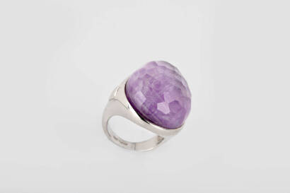 An amethyst ring, the pear shape facetted amethyst set in polished bezel. Silver. Weight 20.98 grams. Size O.