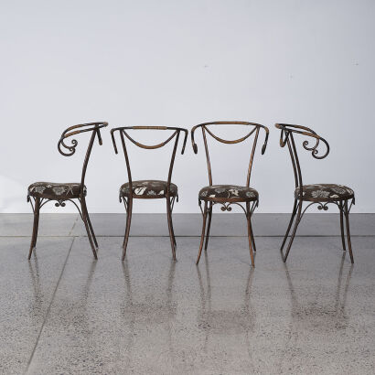 A Set Of Four Wrought Iron Garden Chairs