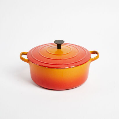 An Orange Le Crest Cast Iron Saucepan
