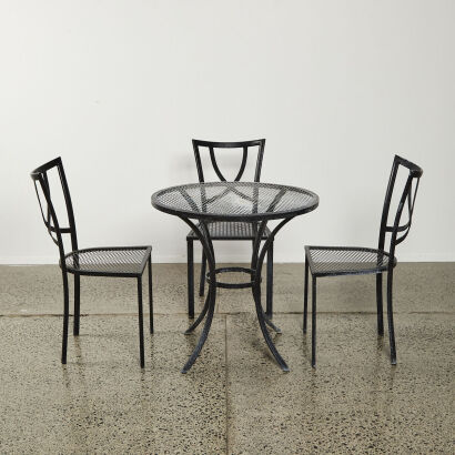 A Black Mesh Metal Patio Table And Chair