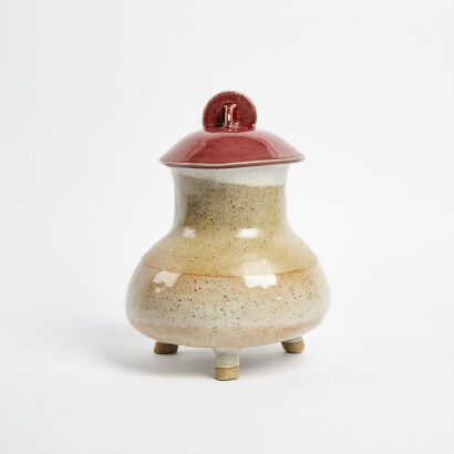 A Three Legged Large Heavy Pottery Jar With Lid