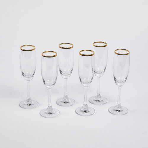 A Set Of Six Gold Rimmed Champagne Glasses