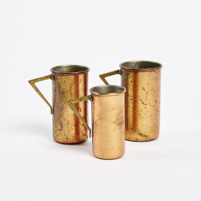 A Set Of Three Copper Measuring Cups