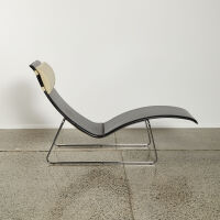 An Italian Minimal Chaise Lounge In Black Full Grain Leather And Metal Sleigh Base