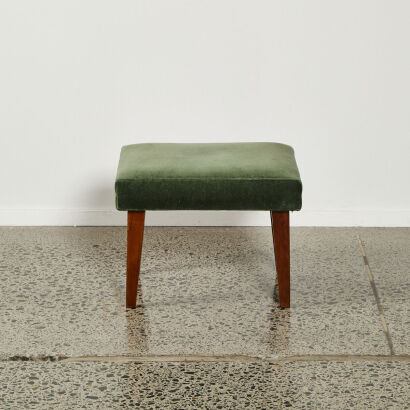 A Mid-Century Foot Stool With Green Upholestry
