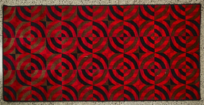 A Retro Red And Black Patterned Rug