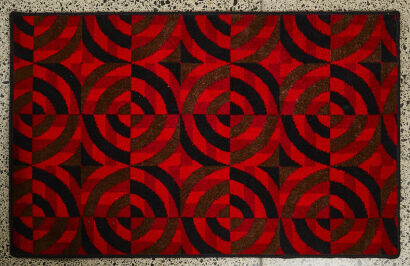 A Retro Red And Black Patterned Rug