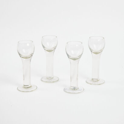 A Set Of Four Solid Stem Liqeur Glasses
