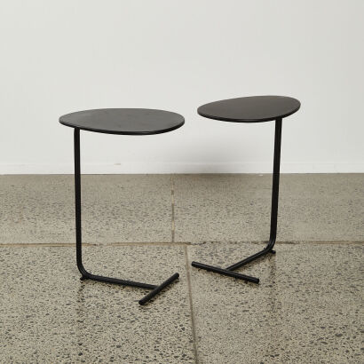 A Pair Of Black Oval Top Metal End Tables