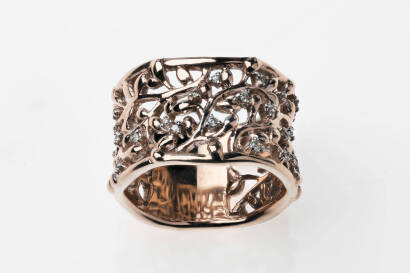 A gold band ring, of pierced foliate design. Total known diamond weight 0.15 carat. 9ct rose gold. Weight 8.7 grams. Size N 1/2. &nbsp;Width 12mm.