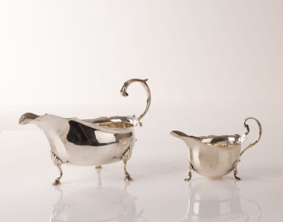A Pair of Sterling Silver Creamers