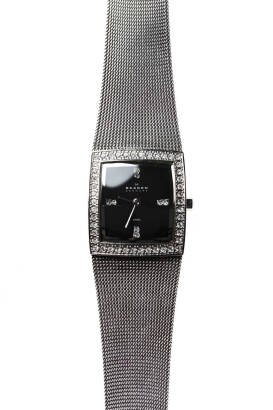 A Lady's stainless steel wristwatch, Skagen. Quartz. 25mm. Rectangular case with black dial and paste set bezel. Mesh bracelet.