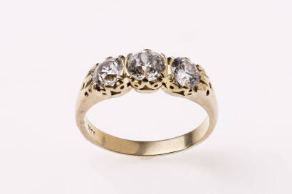 A diamond bridge ring, set three across with three old European cut diamonds of estimated total weight 1.66 carats. 18ct yellow gold. Weight 5.2 grams. Size N.