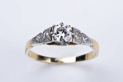 A diamond solitaire ring, the old cut round brilliant cut diamond of estimated weight 0.42 carat with two bead set diamonds down each shoulder. Yellow gold. Weight 2.72 grams. Size O&frac12;.