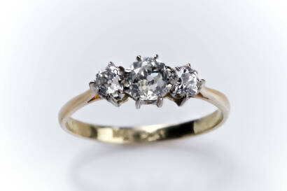 A diamond ring, the three old cut diamonds of total estimated weight 0.45 carat. 18ct yellow gold and platinum. Weight 2.31 grams. Size P.