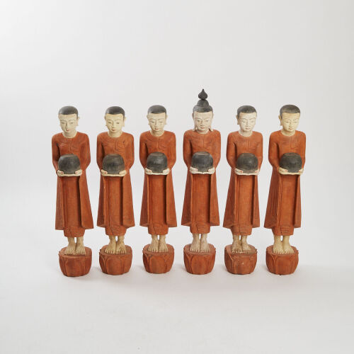 A Wood Carved Buddha and Five Monk Figures