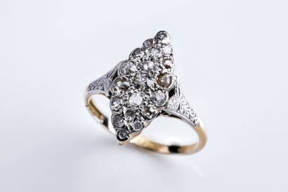 A diamond ring, mixed cut round diamonds of estimated total weight 0.92 carat. Bead set in a marquise shaped cluster with filigree edging, 18ct yellow gold. Weight 3.12 grams. Size P.