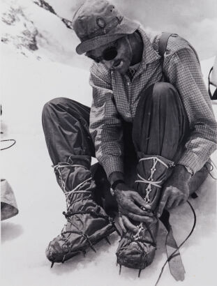 ALFRED GREGORY John Hunt putting on crampons