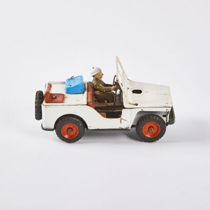 A Vintage Tin Plate Jeep Toy With Driver